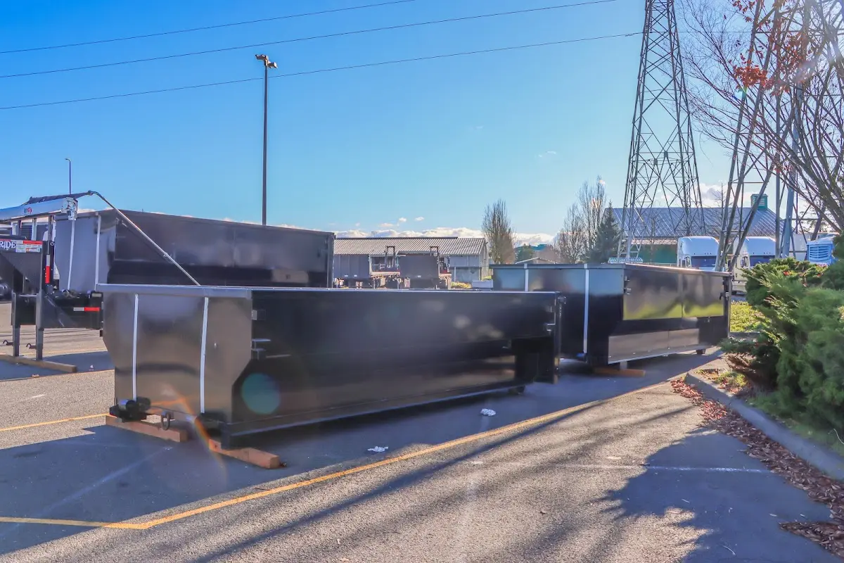 Roll-off dumpster ready for waste disposal at job site for 3 Yard Dumpster Rental in Natick